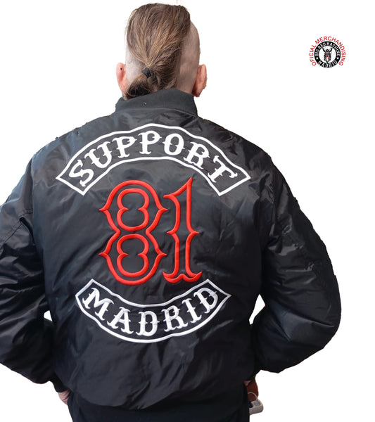 Man wearing black embroidered Support 81 biker jacket outdoors in winter